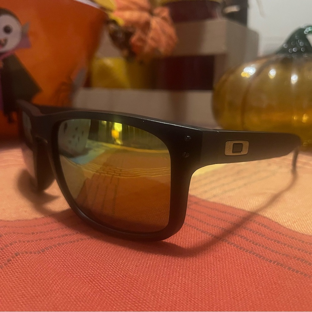 Oakley Holbrook Collection. Black/Gold frames with polarized lenses.